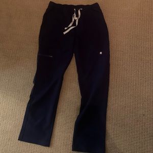 Figs technical collection navy scrub pants. Button closure.